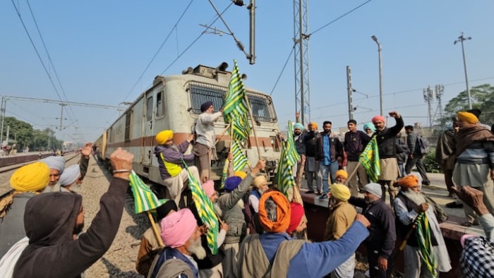 Farmers stop a train coming from Sangrur.