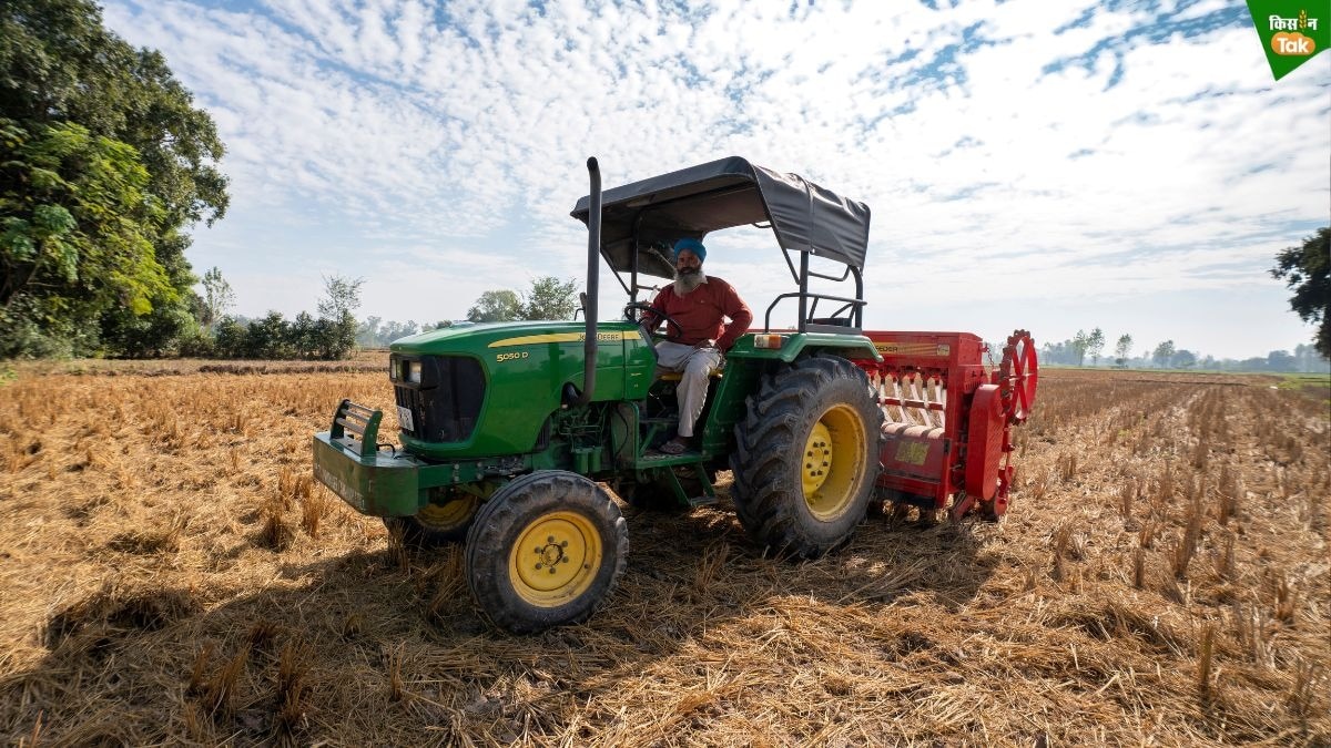 farmer sowing with happy seeder