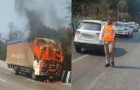 मुंबई-पुणे महामार्गावरती कंटेनरनं घेतला पेट, चालत्या वाहनातून ड्रायव्हरने मारली उडी अन्... Mumbai Pune Expressway Contaner Fire