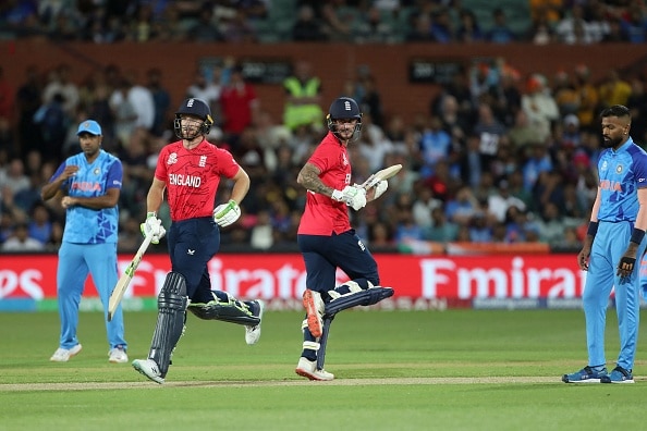Jos Buttler and Alex Hales run between the wickets as Hardik Pandya looks on during 2022 T20 World Cup semis