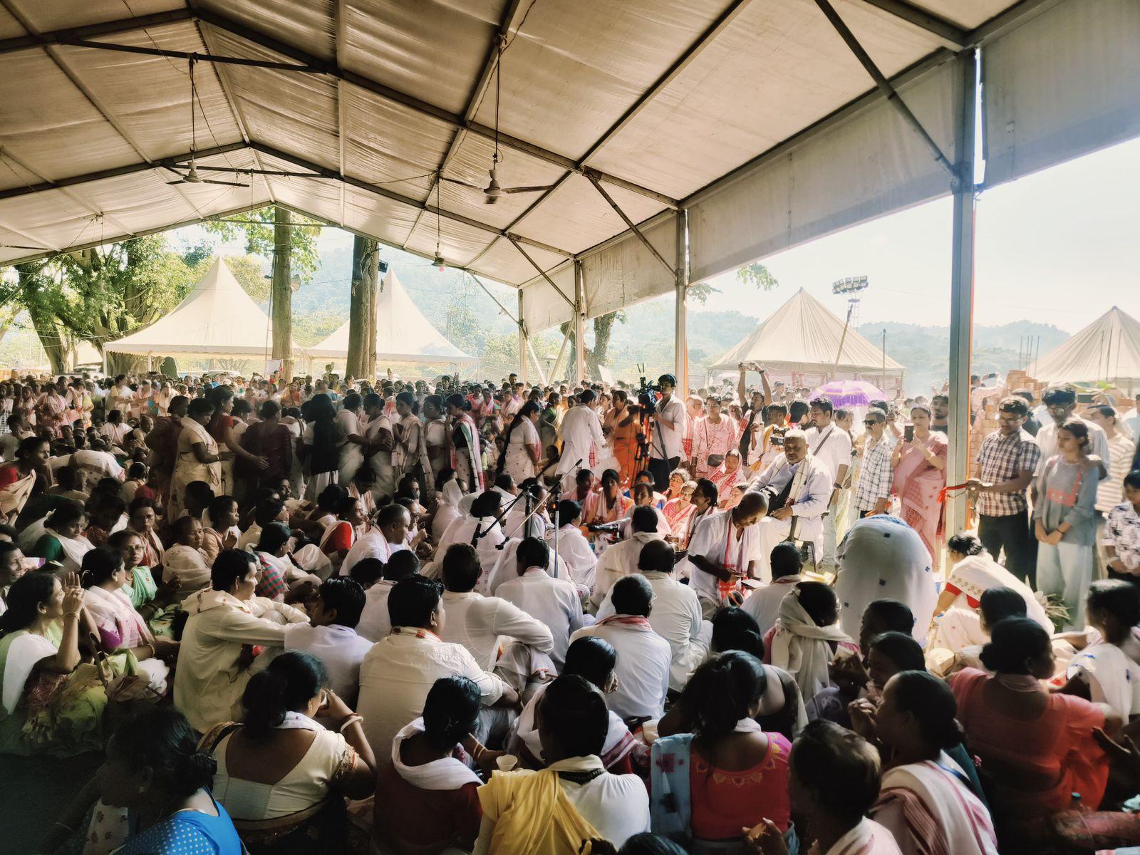 People engaged in memorial services at Zubeen's memorial site