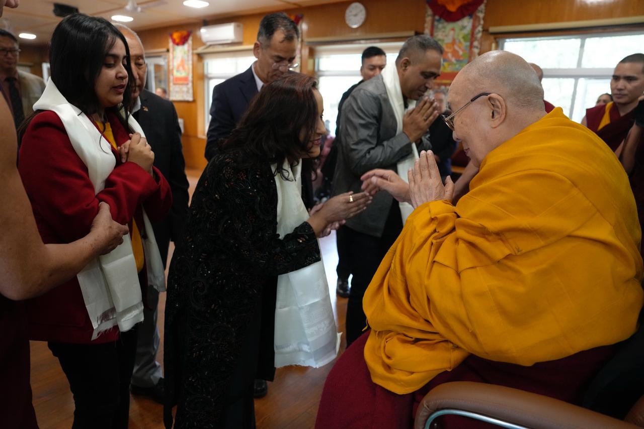 My family receiving blessings from His Holiness the Dalai Lama 