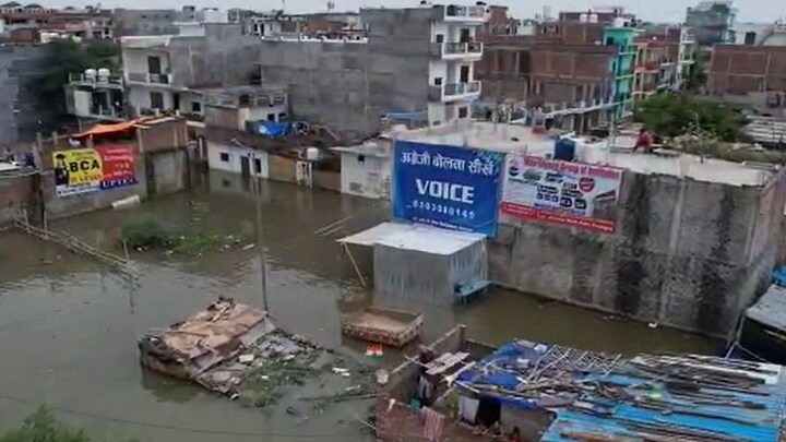 प्रयागराज: ड्रोन से देखिए गंगा-यमुना का जल तांडव, लबालब गलियां, पानी से घिरे सूने मकान UP Tak