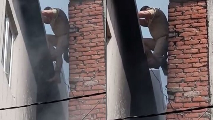 दारोगा ने जान जोखिम में डालकर बिल्डिंग में आग फैलने से रोकने की कोशिश की, वीडियो वायरल UP Tak