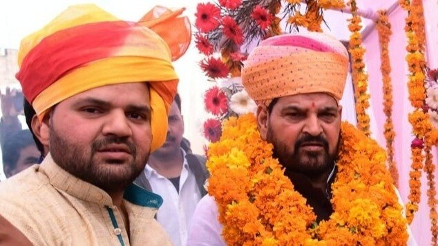 Karan Bhushan Singh (left) is the son of BJP MP Brij Bhushan Singh. (Credit: Facebook/ Karan Bhushan Singh)