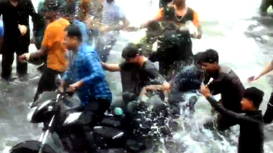 woman on bike splashed lucknow