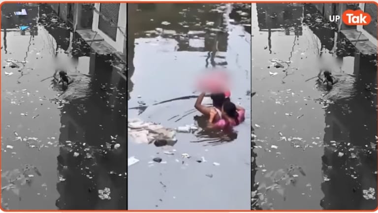 दोनों हाथ से बच्चा सिर के ऊपर उठा मां-पिता ने पार किया पानी... प्रयागराज में बाढ़ का हाहाकार, पूरे यूपी का हाल जानिए Prayagraj flood viral video.