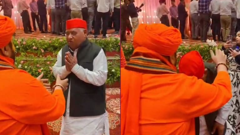 क्या सांसद अवधेश प्रसाद ने अयोध्या के महंत राजूदास का पैर छुआ? वायरल वीडियो का सच कुछ और है Awadhesh Prasad viral video screengrab.
