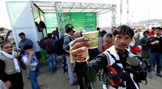 Apart from small kirana stores lining the edges of the road there are company outlets and promotional vans selling everything from tea to bank loans.  (Photo: Shekhar Ghosh) 