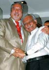 Wingtip to Wingtip: Kingfishers Vijay Mallya (left) and Jets Naresh Goyal after announcing the alliance.