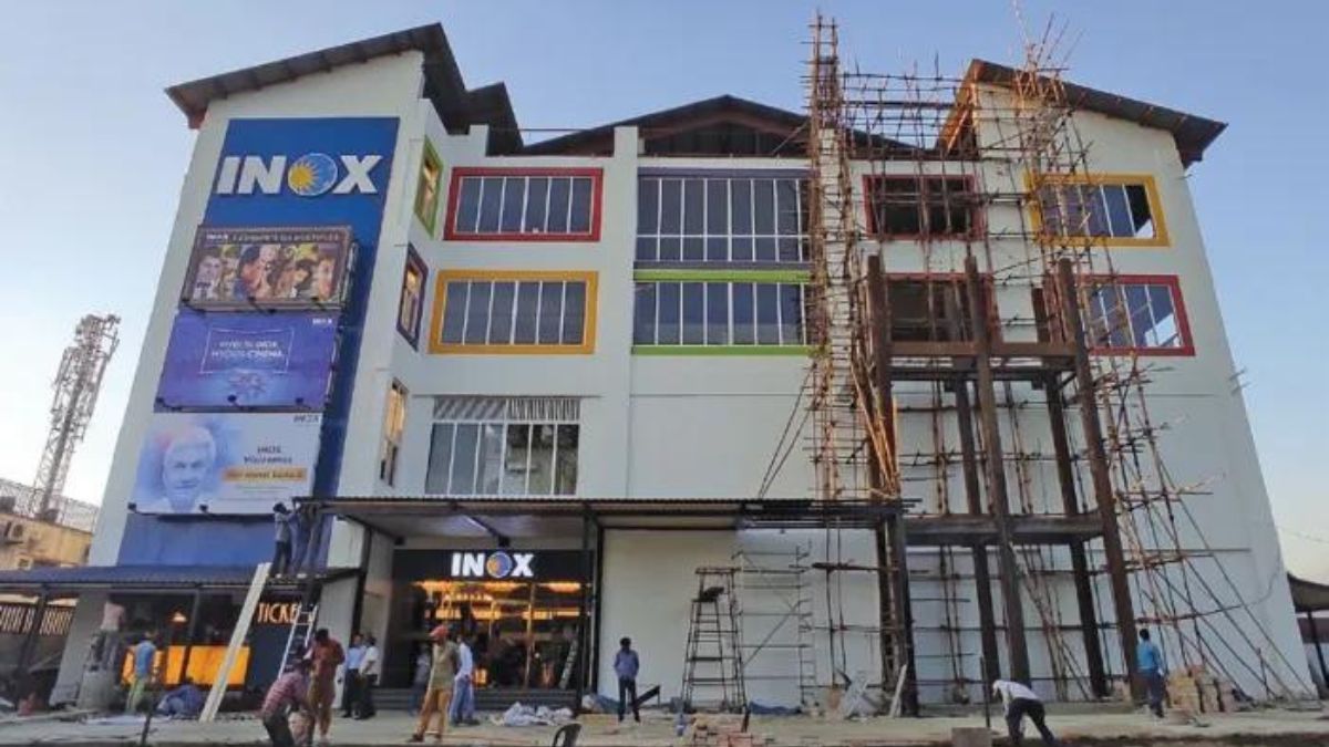 Workers adding the finish touches to INOX Srinagara, moments before the inauguration (photo- Kashmir Reader)