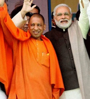 modi-adityanath_120314080707.gif