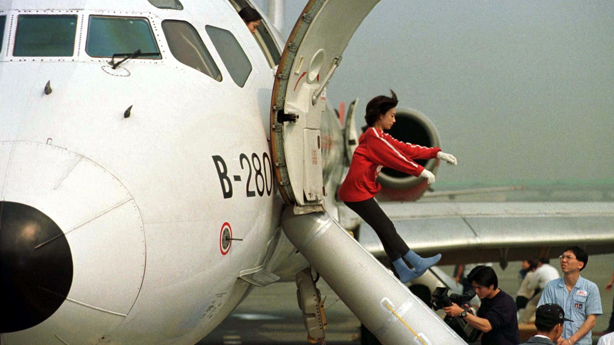 What happens when you open the flight emergency exit door?