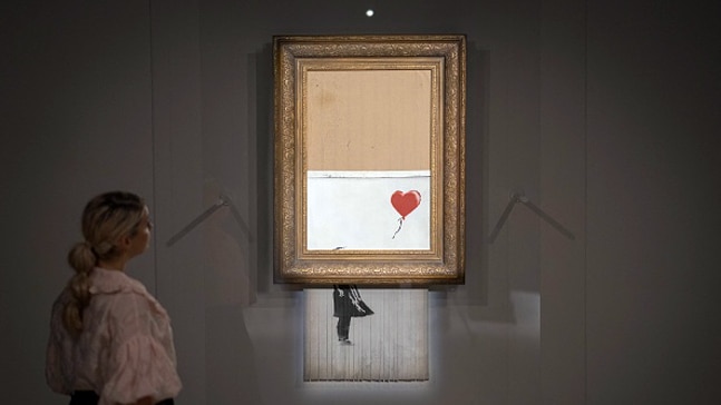 Girl with balloon-Love is in the Bin by Banksy. Photo: Getty Images Girl with balloon-Love is in the Bin by Banksy. Photo: Getty Images