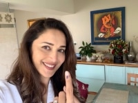 Mumbai  Actress Madhuri Dixit shows her inked finger after casting her vote for the Maharashtra Assembly elections  in Mumbai on Oct 21  2019  Photo  IANS 