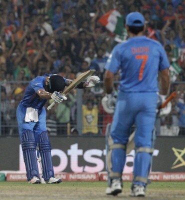 Kohli bowing to Sachin after scoring 50 against Bangladesh