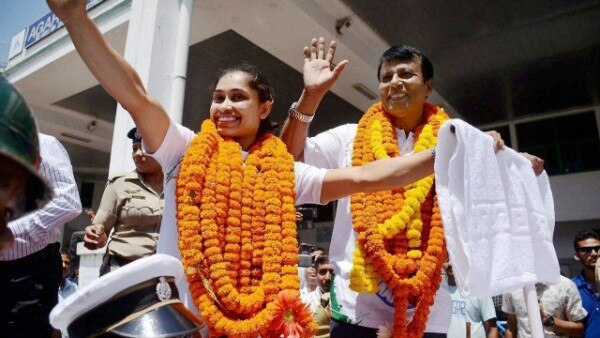 घर वापसी के बाद दीपा अपने कोच के साथ. PTI