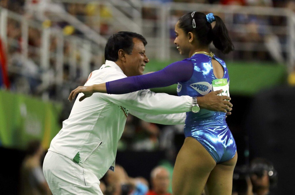 Dipa Karmakar (IND) of India reacts with her coach. REUTERS