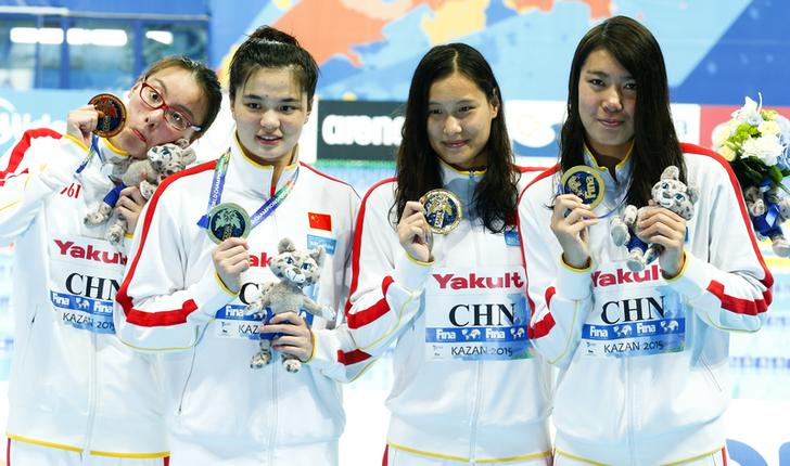 China's first placed Fu, Shi, Lu and Shen pose with medals after the women's 4x100m medley relay final at the Aquatics World Championships in Kazan