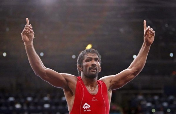 India's Yogeshwar Dutt celebrates his victory over North Korea's Jong Myong Ri for the gold medal on the Men's 60Kg Freestyle wrestling at the ExCel venue during the London 2012 Olympic Games