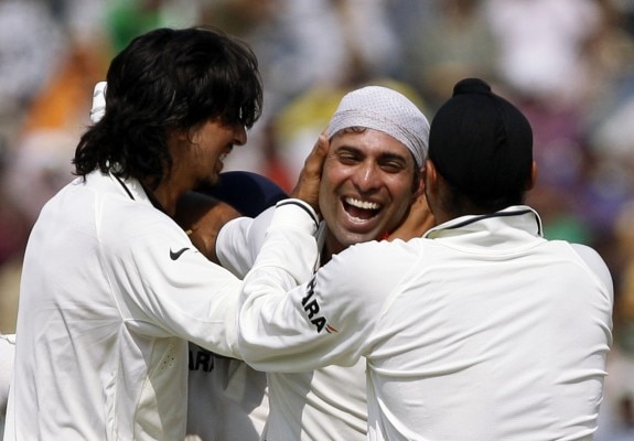 India's Vangipurappu Laxman (C), Ishant Sharma (L) and Harbhajan Singh embrace as they celebrate India's victory over Australia on the fifth day of their first test cricket match in Mohali October 5, 2010. REUTERS/Andrew Caballero-Reynolds (INDIA - Tags: SPORT CRICKET) - RTXT25W