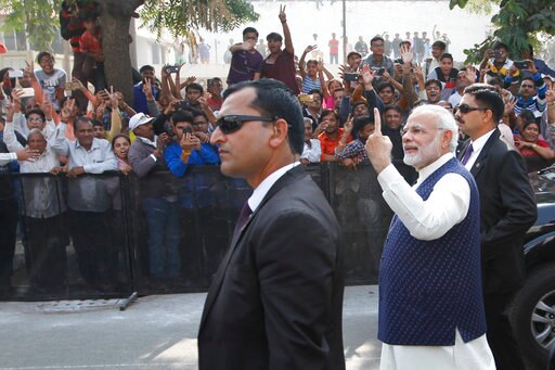 Indian Prime Minister Narendra Modi displays his inked finger after casting his vote in the second phase of the Gujarat state assembly elections in Ahmadabad, India, Thursday, Dec. 14, 2017. The result will be declared on Dec. 18. (AP Photo/Ajit Solanki)