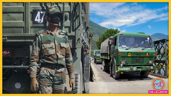 एक भारतीय जवान आर्मी के ट्रक के साथ खड़े हुए, ये ट्रक लद्दाख जा रहा है. (फोटो- PTI) Indian Army 2344