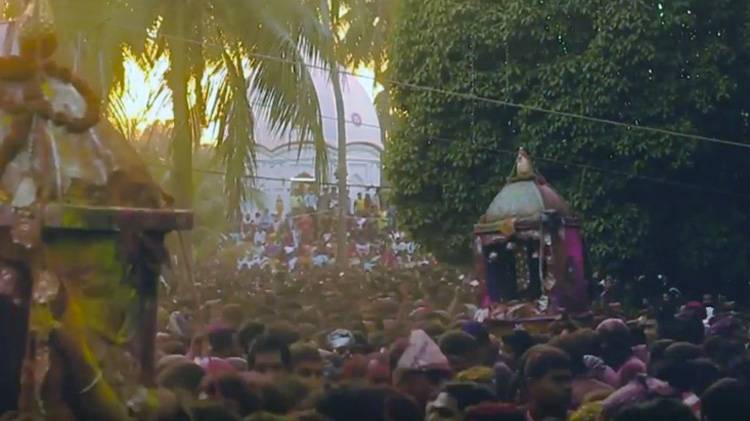 Krishna or the idol of Krishna is prevented from entering the Satra premises by the Vaishnavas with four bamboos in front of Kirtan Ghar. Photo Courtesy YouTube