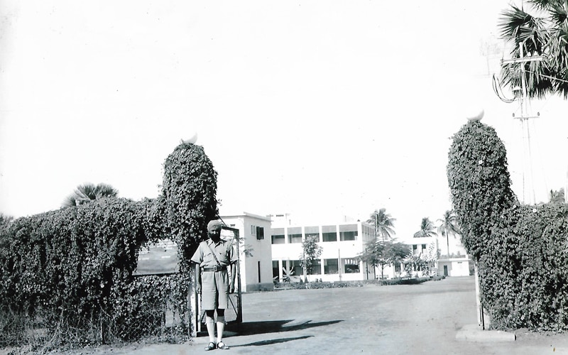 page-48---the-original-front-gate-of-batanagar-with-its-first-dwelling-in-the-background-1_082126013251.jpg