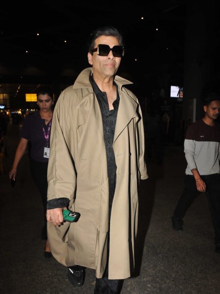 मुंबई की गर्मी में ट्रेंच कोट पहने दिखे करण जौहर, ट्रोल्स बोले- पैराशूट पहनकर उड़ जाओ